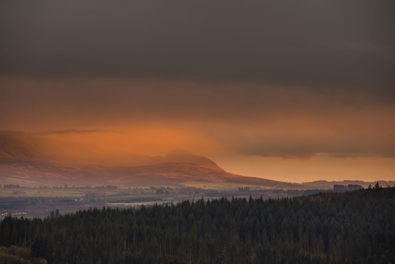 view towards the Campsie Fells under red clouds