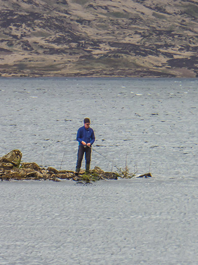 man fishing in the distance