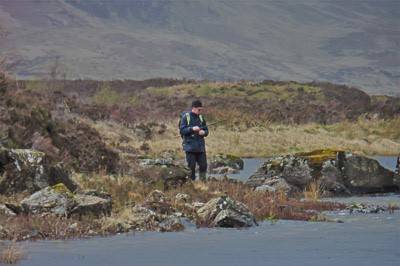 man fishing in the distance